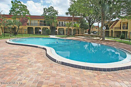 6655 Bell Tower Ct Unit 7, Jacksonville, FL 32217 - pool featuring a patio area and fence