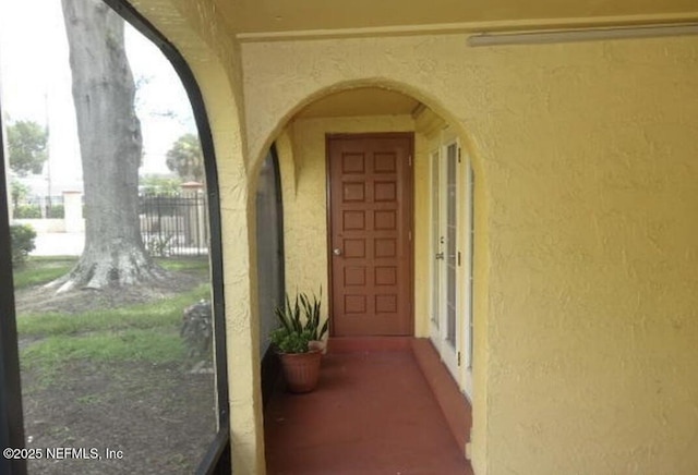 6655 Bell Tower Ct Unit 7, Jacksonville, FL 32217 - entrance to property with stucco siding and fence