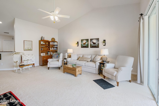 living area featuring visible vents, baseboards, ceiling fan, carpet flooring, and high vaulted ceiling