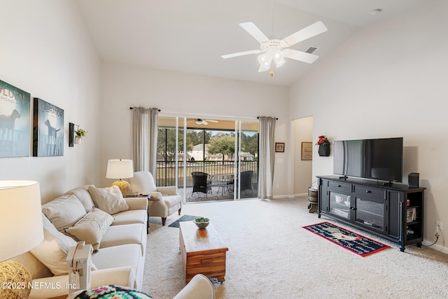 living area with high vaulted ceiling, carpet flooring, visible vents, and ceiling fan