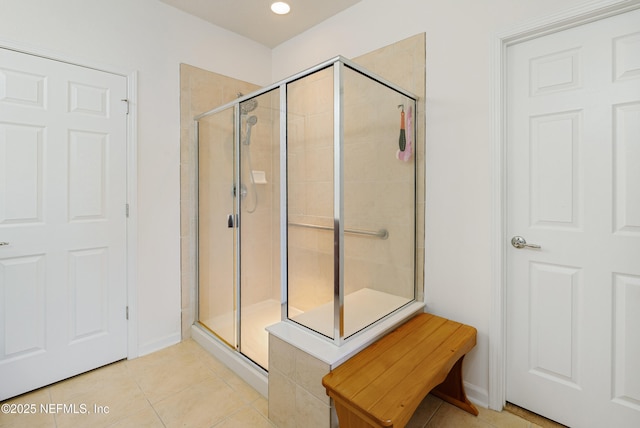 full bath with tile patterned floors and a shower stall