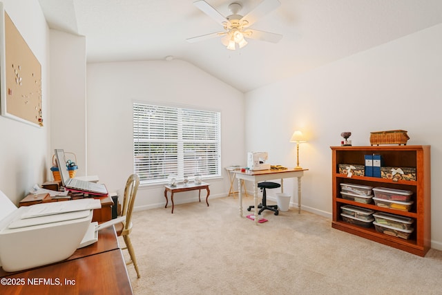 office area with lofted ceiling, carpet flooring, baseboards, and ceiling fan