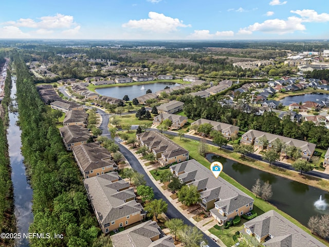 drone / aerial view featuring a residential view and a water view