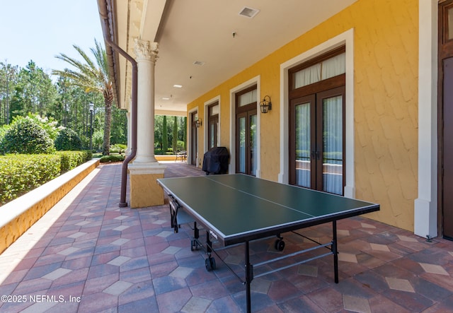 view of patio featuring french doors, visible vents, and outdoor dining space