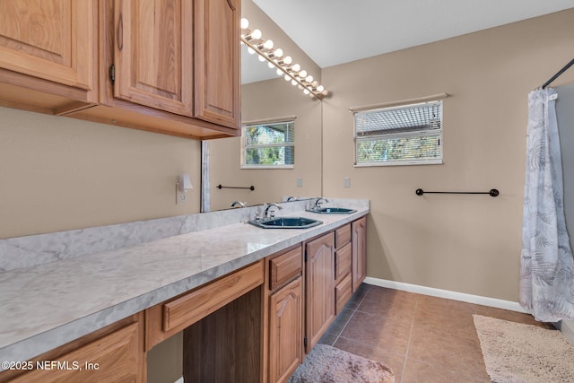 full bath with tile patterned flooring, vanity, and baseboards