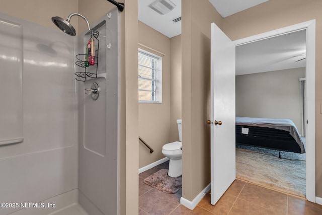 ensuite bathroom with tile patterned flooring, visible vents, toilet, and walk in shower