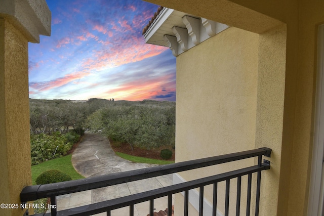 view of balcony at dusk
