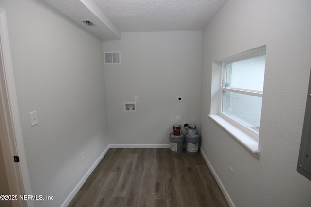 washroom with washer hookup, a textured ceiling, visible vents, and electric dryer hookup