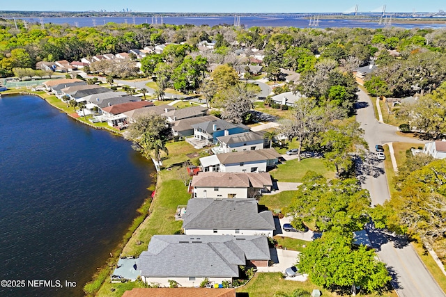 bird's eye view featuring a residential view and a water view