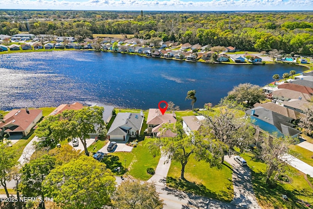 drone / aerial view with a residential view and a water view