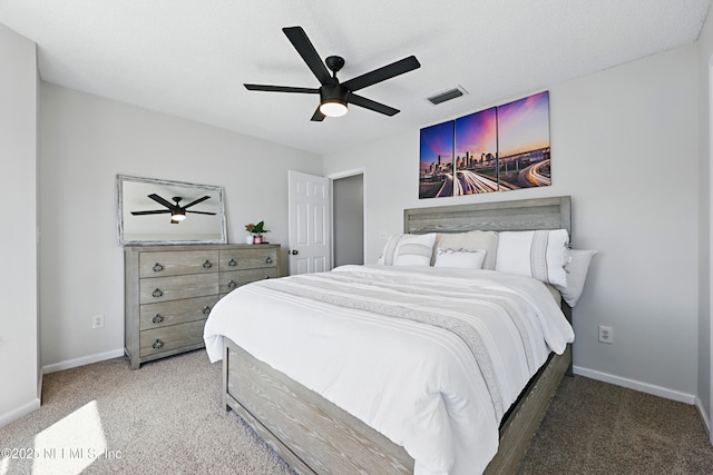 bedroom with visible vents, carpet flooring, and baseboards