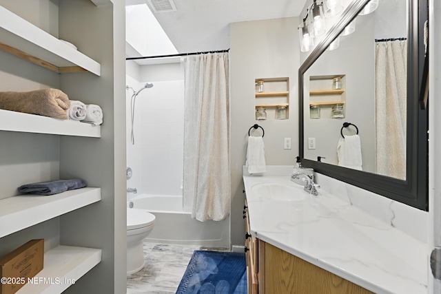 full bath with visible vents, toilet, marble finish floor, shower / bath combo, and vanity