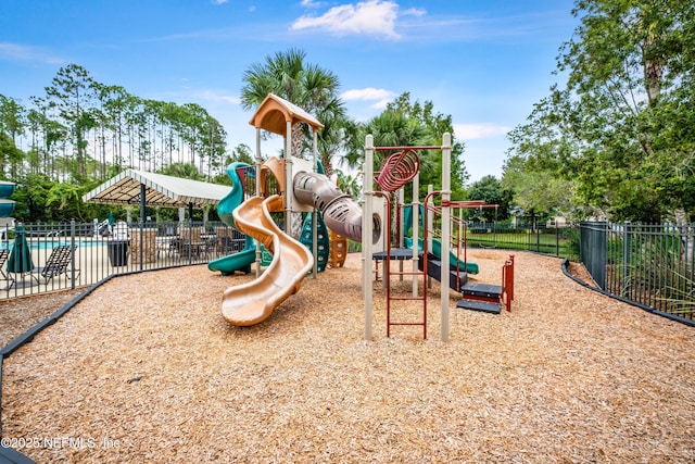 community jungle gym featuring fence