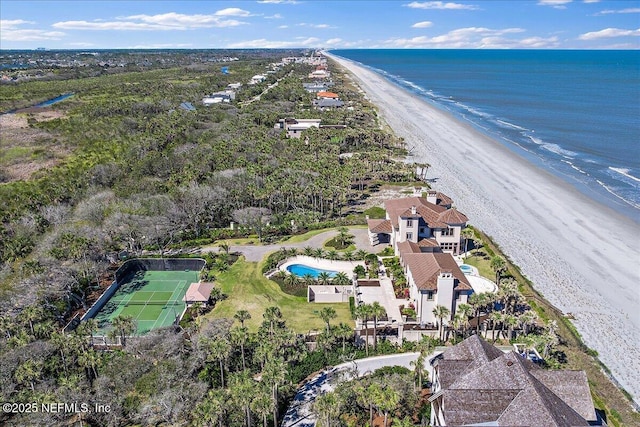 drone / aerial view featuring a beach view and a water view