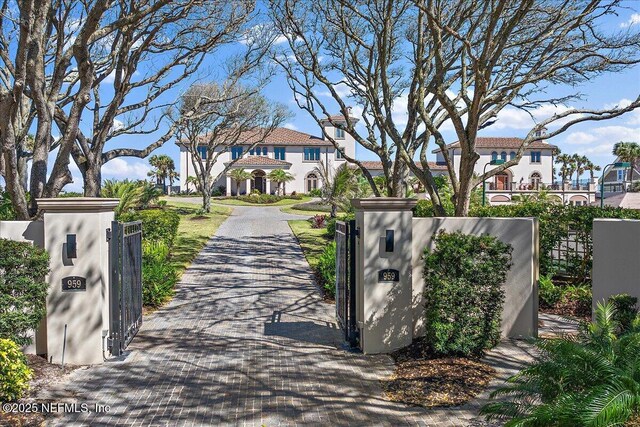 view of gate with fence