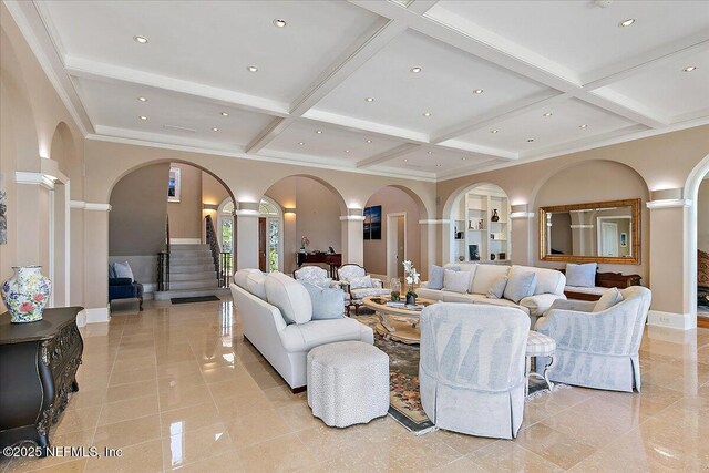 living room featuring beamed ceiling, stairway, recessed lighting, arched walkways, and coffered ceiling