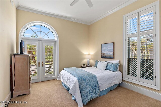 carpeted bedroom featuring crown molding, baseboards, french doors, a ceiling fan, and access to outside