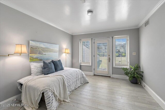 bedroom with visible vents, light wood-style flooring, crown molding, baseboards, and access to exterior