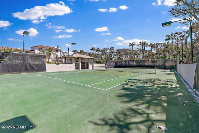 view of sport court with fence