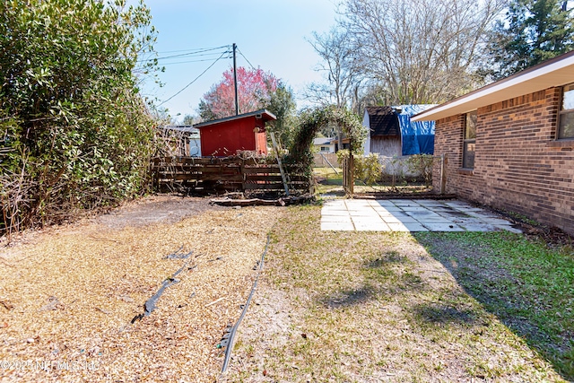 view of yard featuring a patio and fence