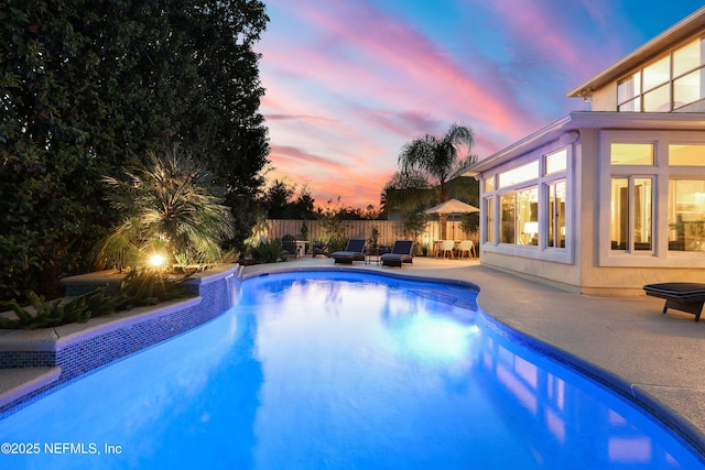 view of pool featuring a fenced in pool, a patio, and fence