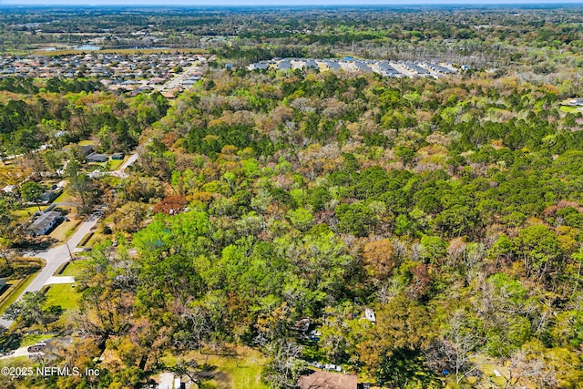 drone / aerial view with a view of trees