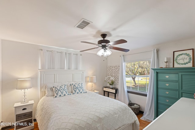 bedroom featuring visible vents and ceiling fan