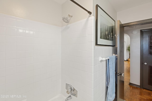 bathroom with shower / washtub combination