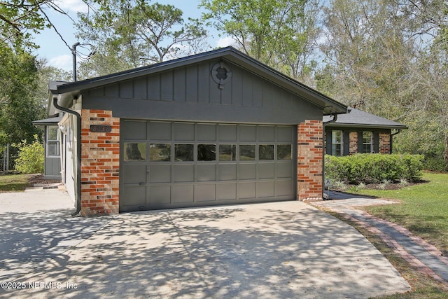 garage featuring driveway