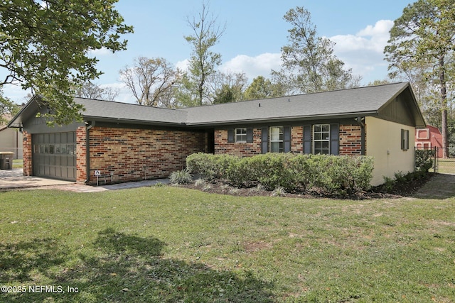 ranch-style home featuring a front yard, an attached garage, brick siding, and concrete driveway