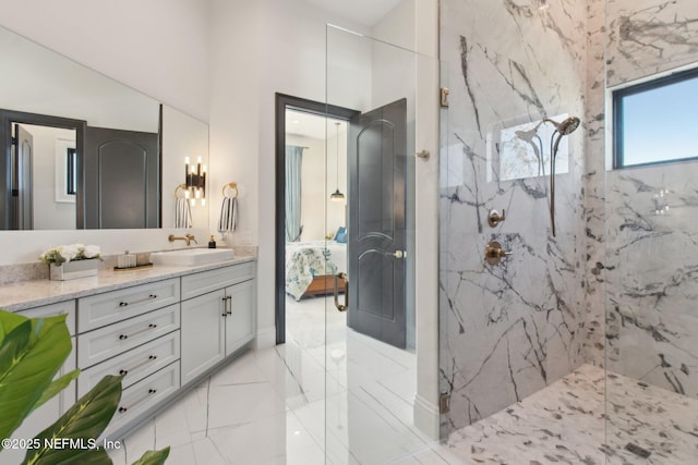 ensuite bathroom with a marble finish shower, vanity, and ensuite bath