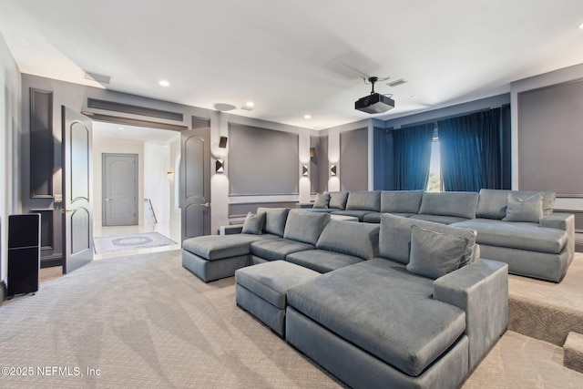 home theater room with recessed lighting and light colored carpet