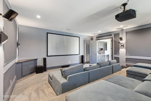 home theater room with recessed lighting, baseboards, and light carpet
