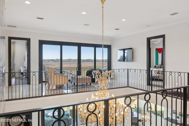 interior space featuring a notable chandelier, recessed lighting, and ornamental molding