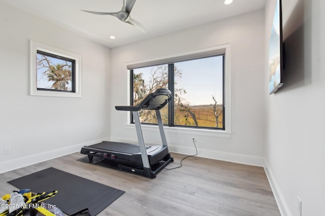 exercise area with recessed lighting, wood finished floors, baseboards, and ceiling fan