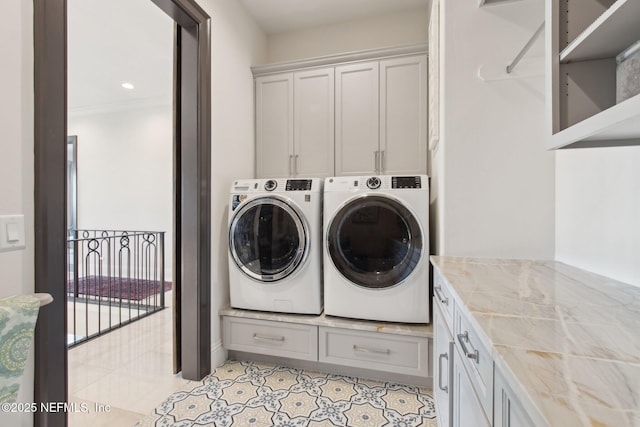 washroom with light tile patterned floors, cabinet space, washing machine and dryer, and recessed lighting
