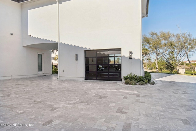 exterior space featuring stucco siding