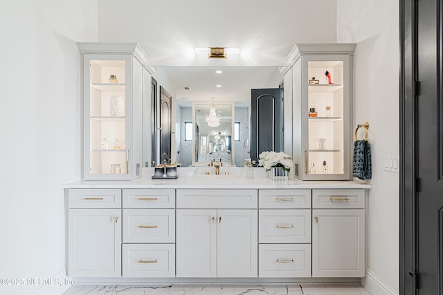 bathroom featuring vanity and baseboards