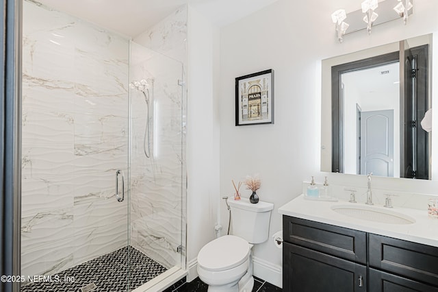 full bathroom featuring a marble finish shower, toilet, vanity, and baseboards