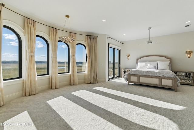 carpeted bedroom featuring access to exterior, recessed lighting, visible vents, and baseboards