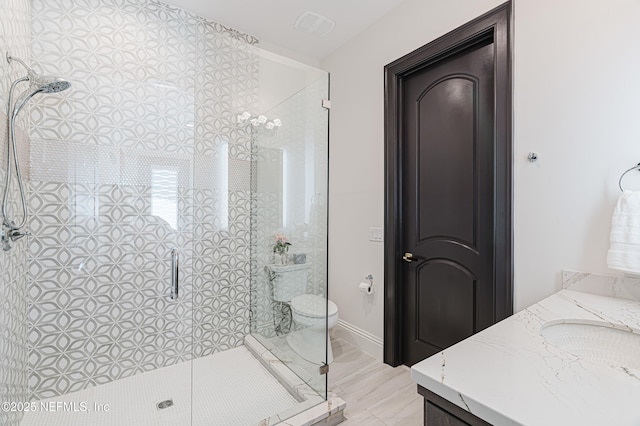full bathroom with visible vents, vanity, toilet, and a shower stall