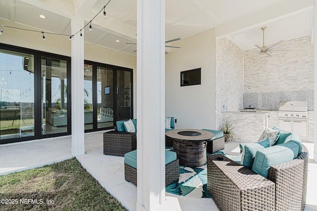view of patio / terrace with grilling area, french doors, an outdoor living space with a fire pit, exterior kitchen, and ceiling fan