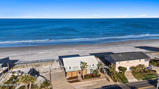 bird's eye view featuring a water view and a view of the beach