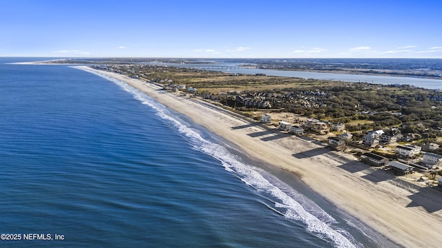 drone / aerial view with a view of the beach and a water view