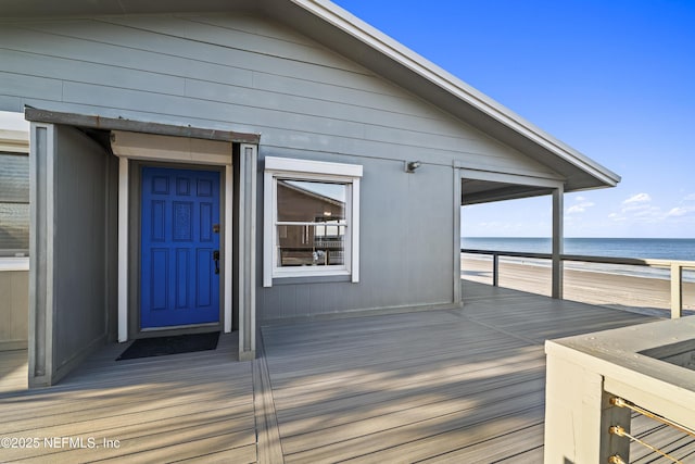 entrance to property with a water view