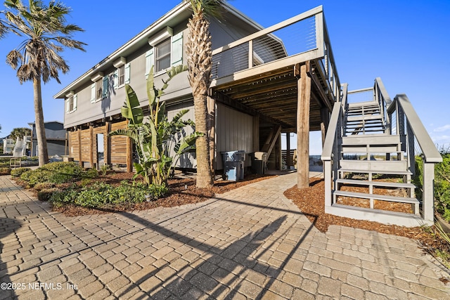 view of property exterior featuring stairs