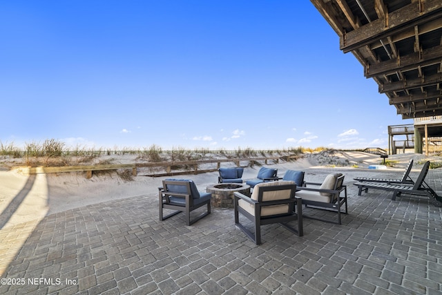 view of patio with an outdoor fire pit