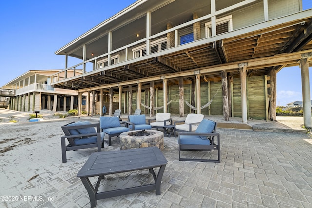 view of patio with a fire pit