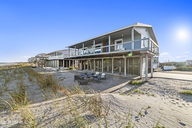 rear view of property featuring a patio area