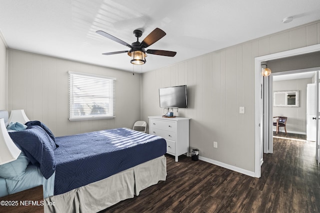 bedroom featuring baseboards, dark wood-style flooring, and ceiling fan